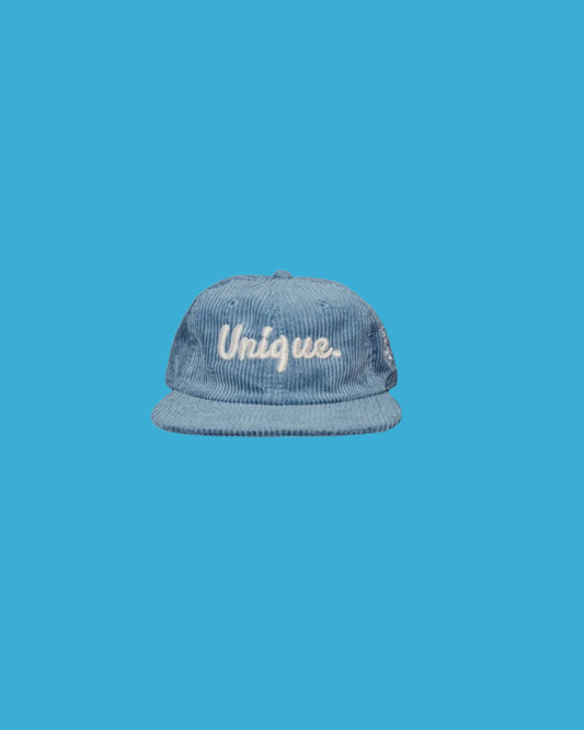 "Unique." Slate Blue Corduroy Cap